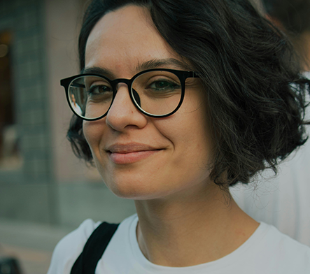 A smiling woman wearing progressive glasses