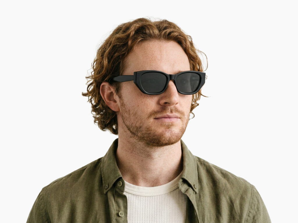 Man model wearing Achebe black acetate sunglasses from Vediview