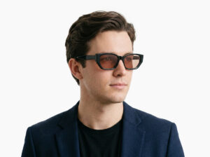 Man model wearing Achebe black acetate sunglasses from Vediview