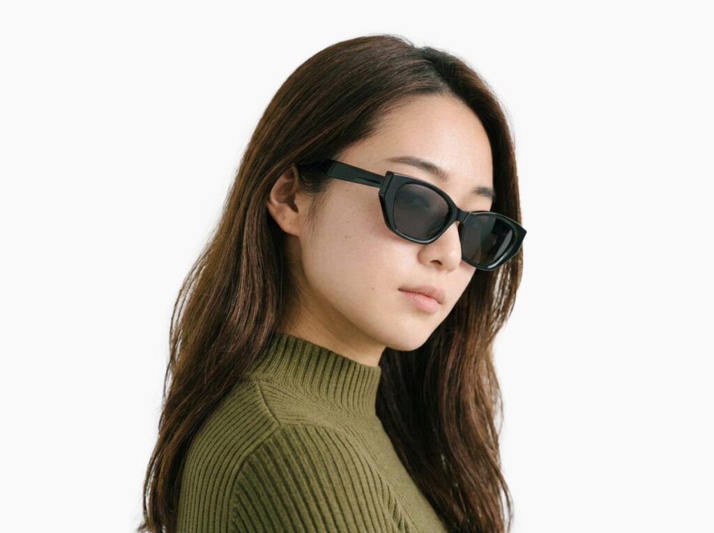 Woman model wearing Achebe black acetate sunglasses from Vediview