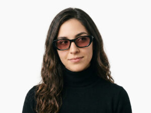 Woman model wearing Achebe black acetate sunglasses from Vediview