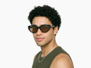 Man model wearing Brancusi black TR90 sunglasses with brown polarized lenses from Vediview