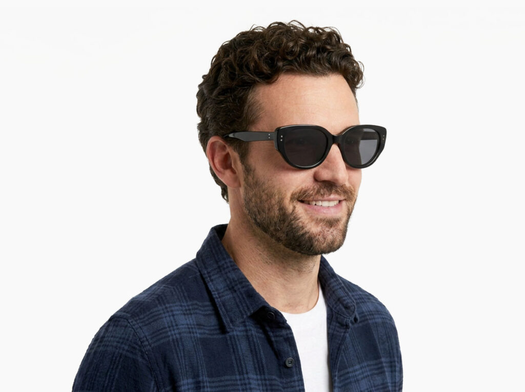 Man model wearing Brancusi black TR90 sunglasses with grey polarized lenses from Vediview
