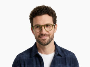 Man model wearing Breuer green acetate eyeglasses from Vediview