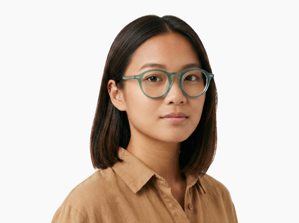 Woman model wearing Breuer blue-green acetate eyeglasses from Vediview
