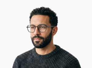 Man model wearing Calder dark grey TR90 eyeglasses from Vediview
