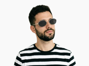 Man model wearing Alva gold metal sunglasses from Vediview