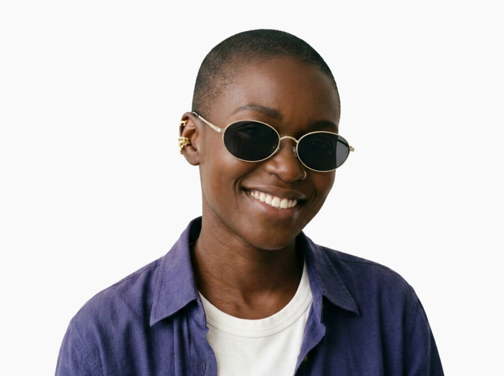 Woman model wearing Alva gold metal sunglasses from Vediview
