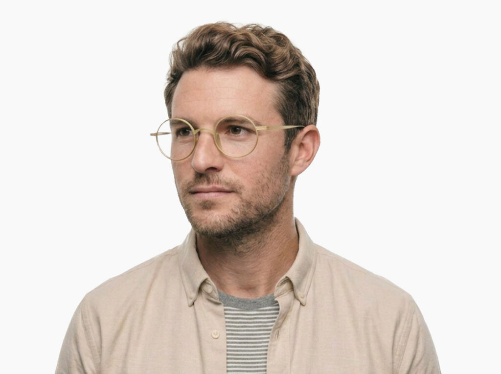 Man model wearing Chaplin gold titanium eyeglasses from Vediview
